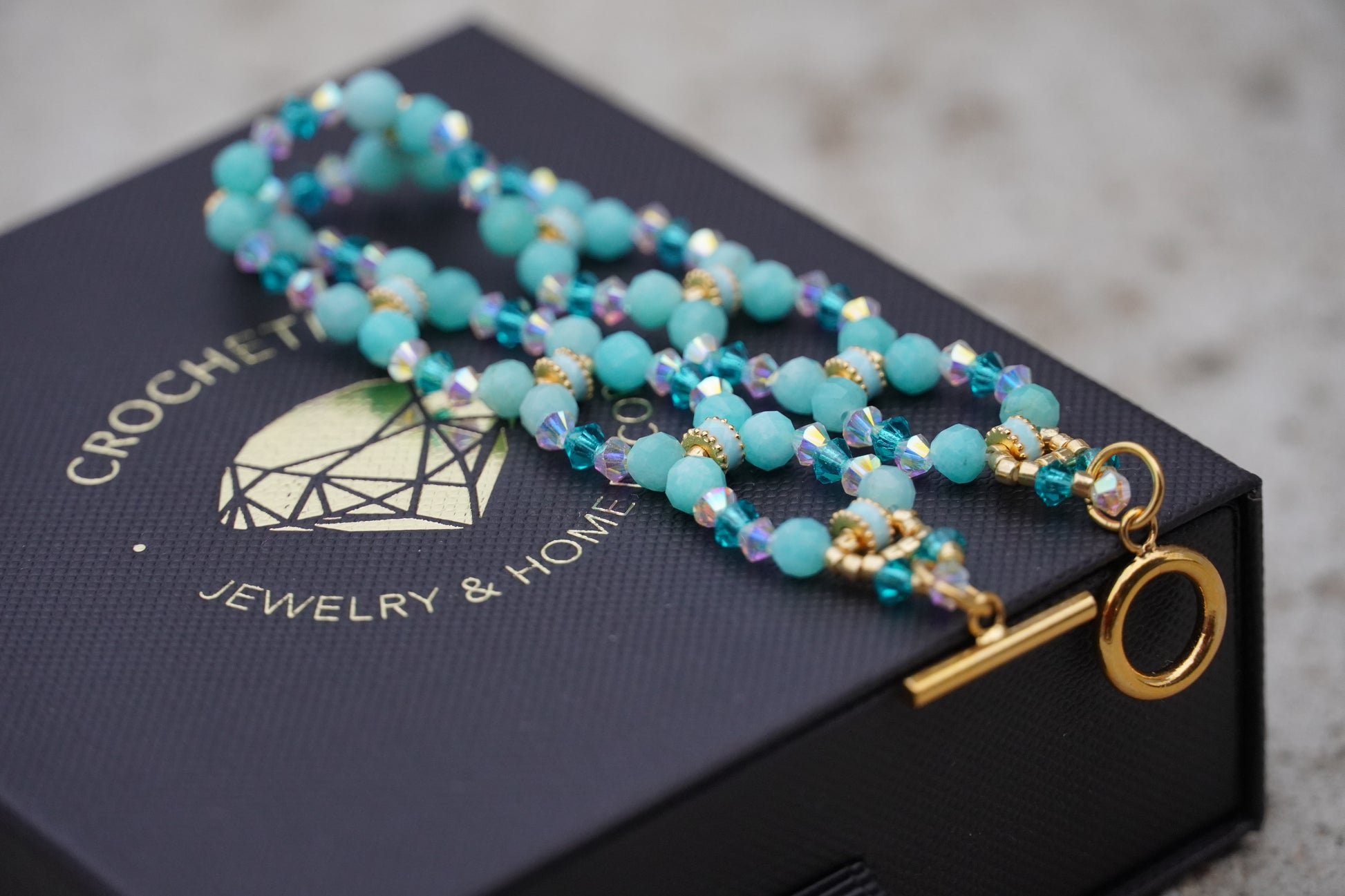 Handmade Peruvian amazonite bracelet detail with enamel tube accents