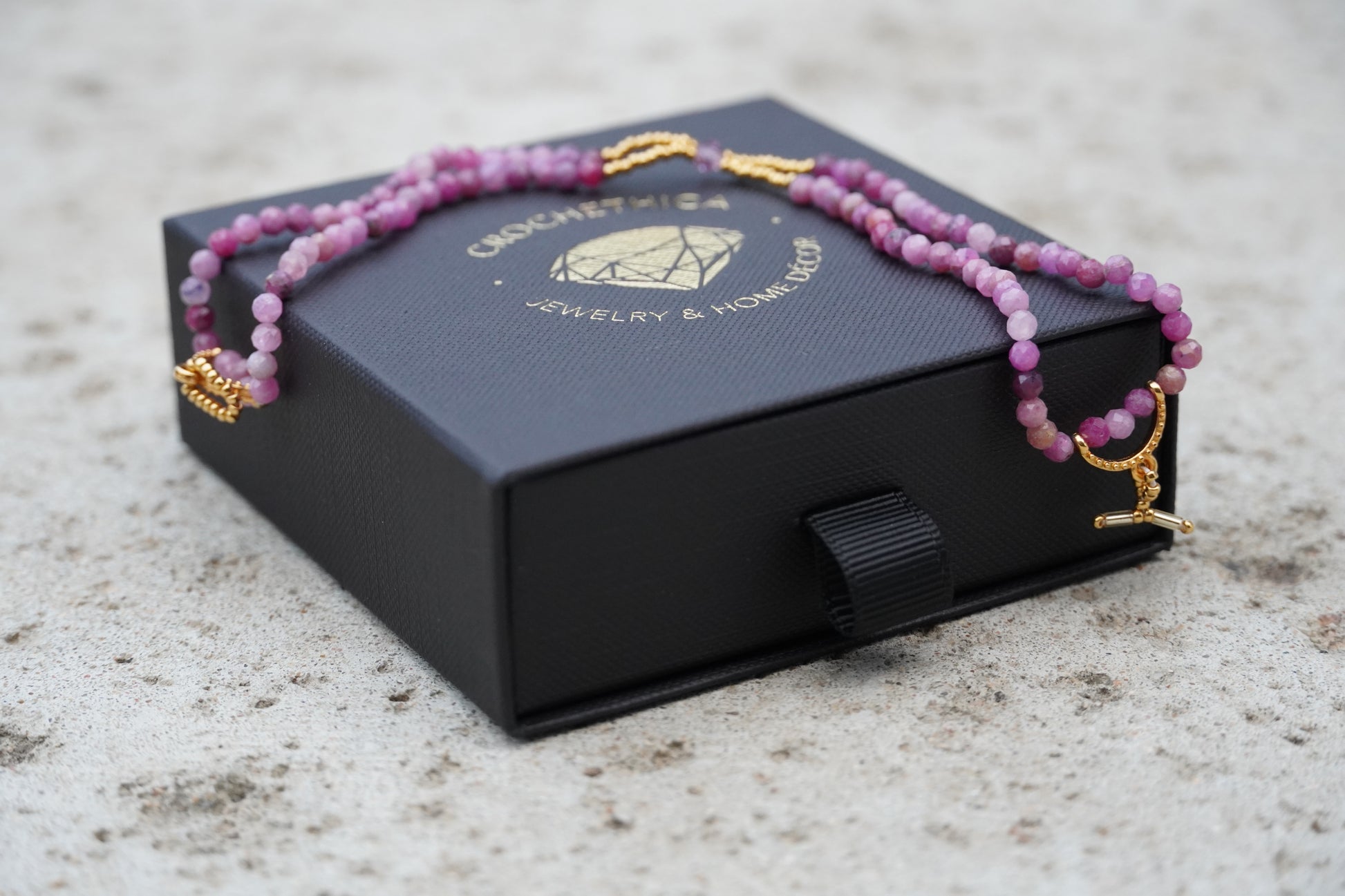 Pink tourmaline bracelet with gold accents and toggle clasp