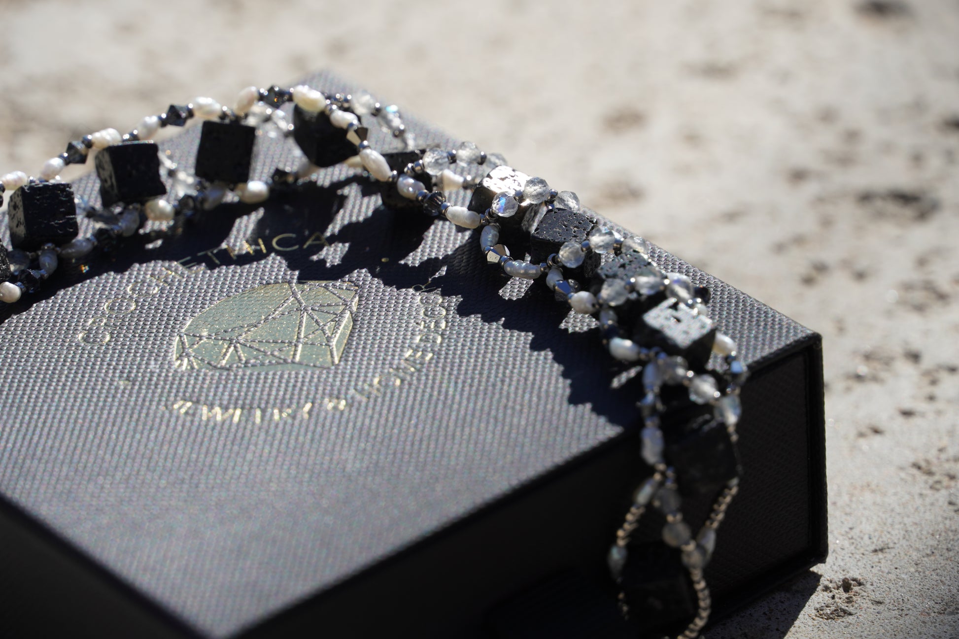 Lava rock bead texture detail on handmade gemstone bracelet