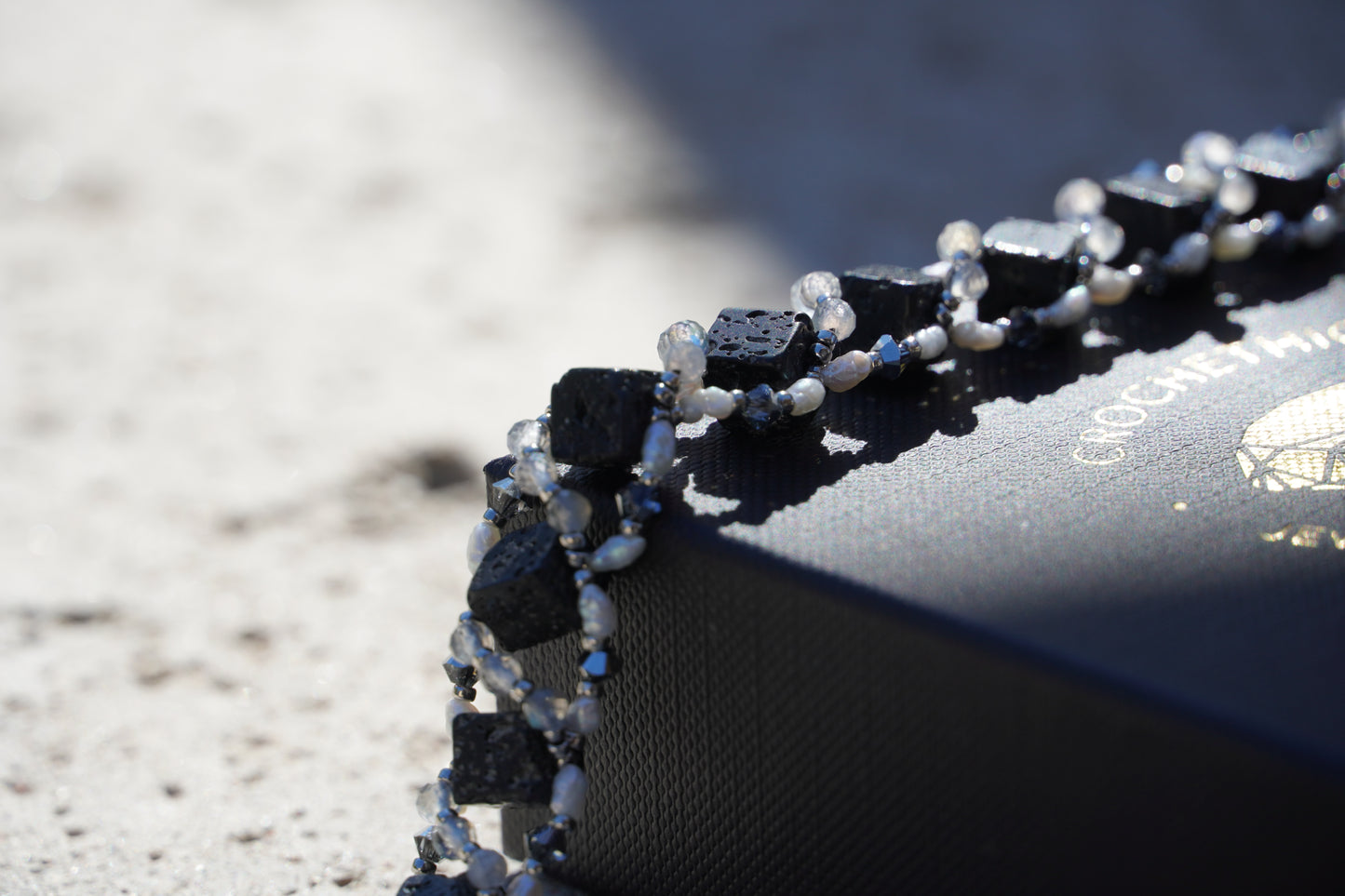 Silver-plated toggle clasp detail on beaded bracelet